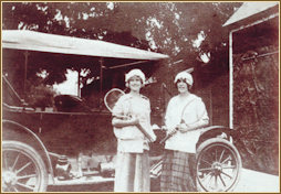 Young women ready for a tennis match circa 1920